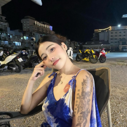 Tattooed Thai cutie getting naughty on bed