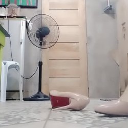 Thai granny teases her legs and feet while wearing a tight dress and heels